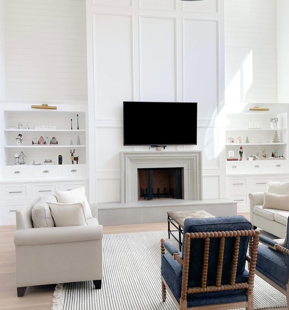Living room built-in cabinetry with shelves and lower storage cabinets